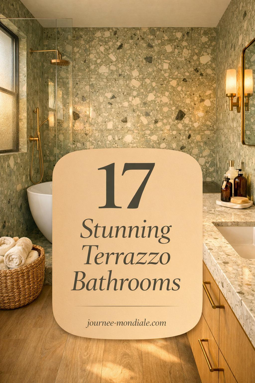 Modern terrazzo bathroom featuring sage green floor-to-ceiling tiles, freestanding white bathtub, brass fixtures, oak vanity