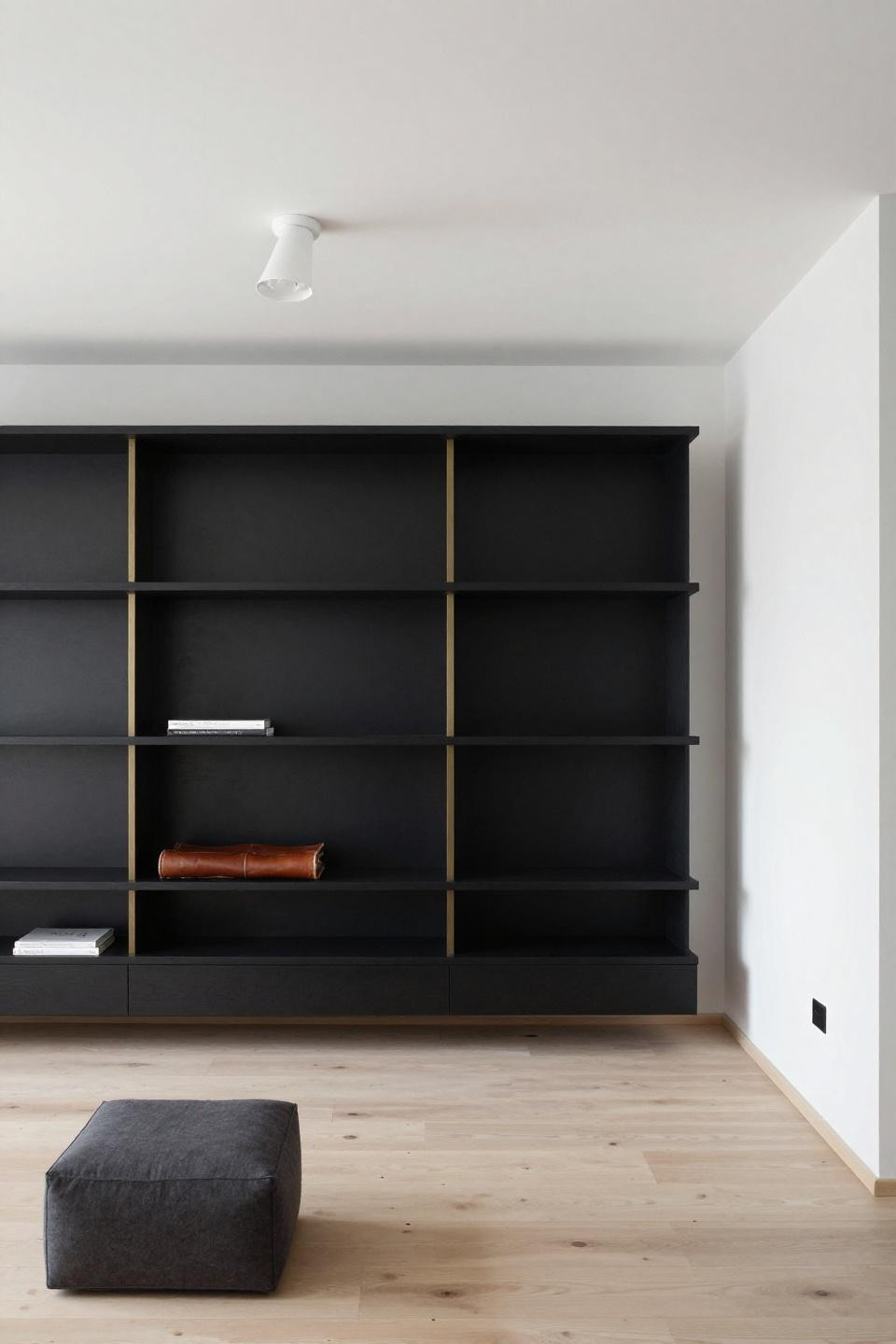 Living room with black accents - modular wall system with brass rods