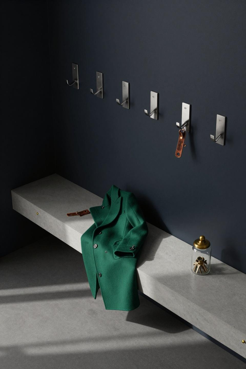 Hall Tree Decorating Ideas - navy wall with geometric stainless steel hooks