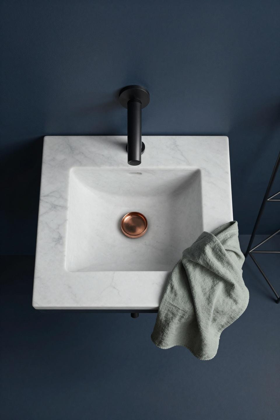 Beautiful Bathrooms Modern - floating Carrara marble vanity against navy wall