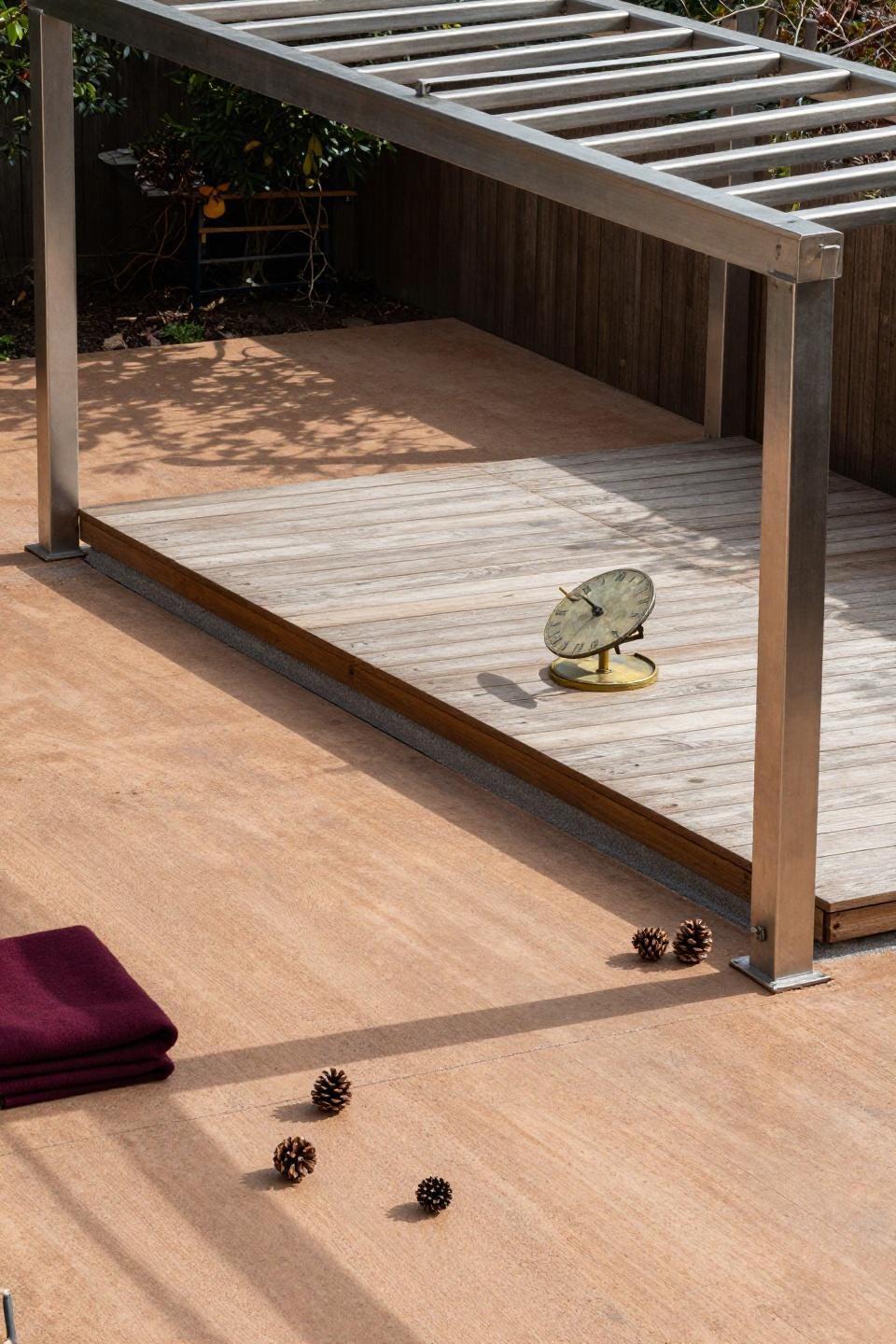 Stamped concrete patio with floating cedar deck island