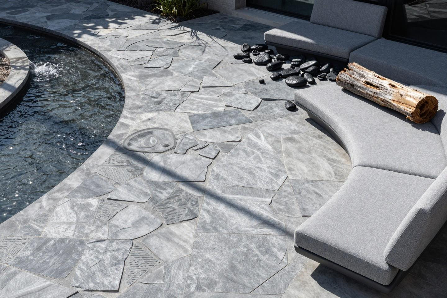 Modern stamped concrete patio with integrated water feature