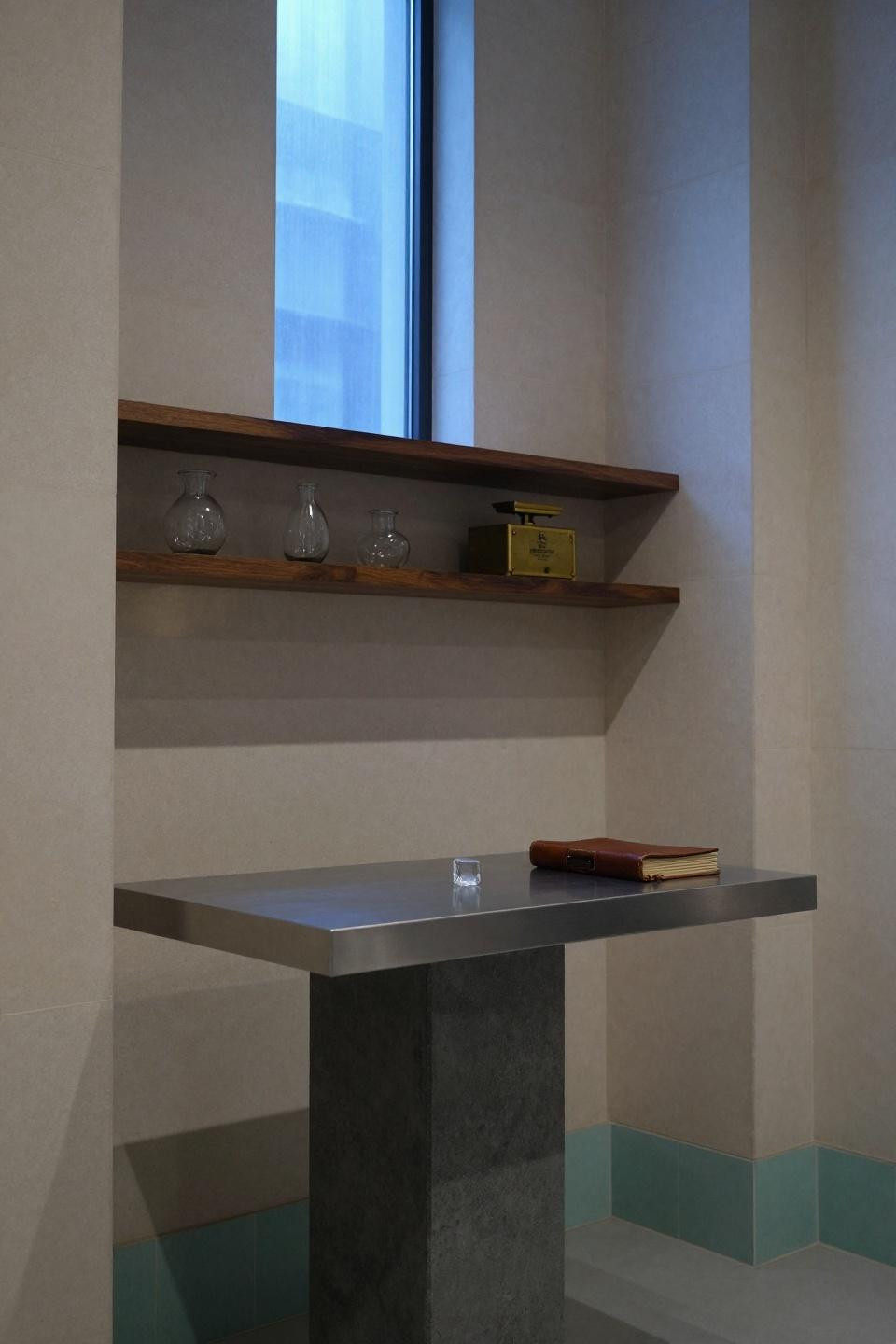 Bar Interior Design Vintage - brushed steel counter with limestone walls