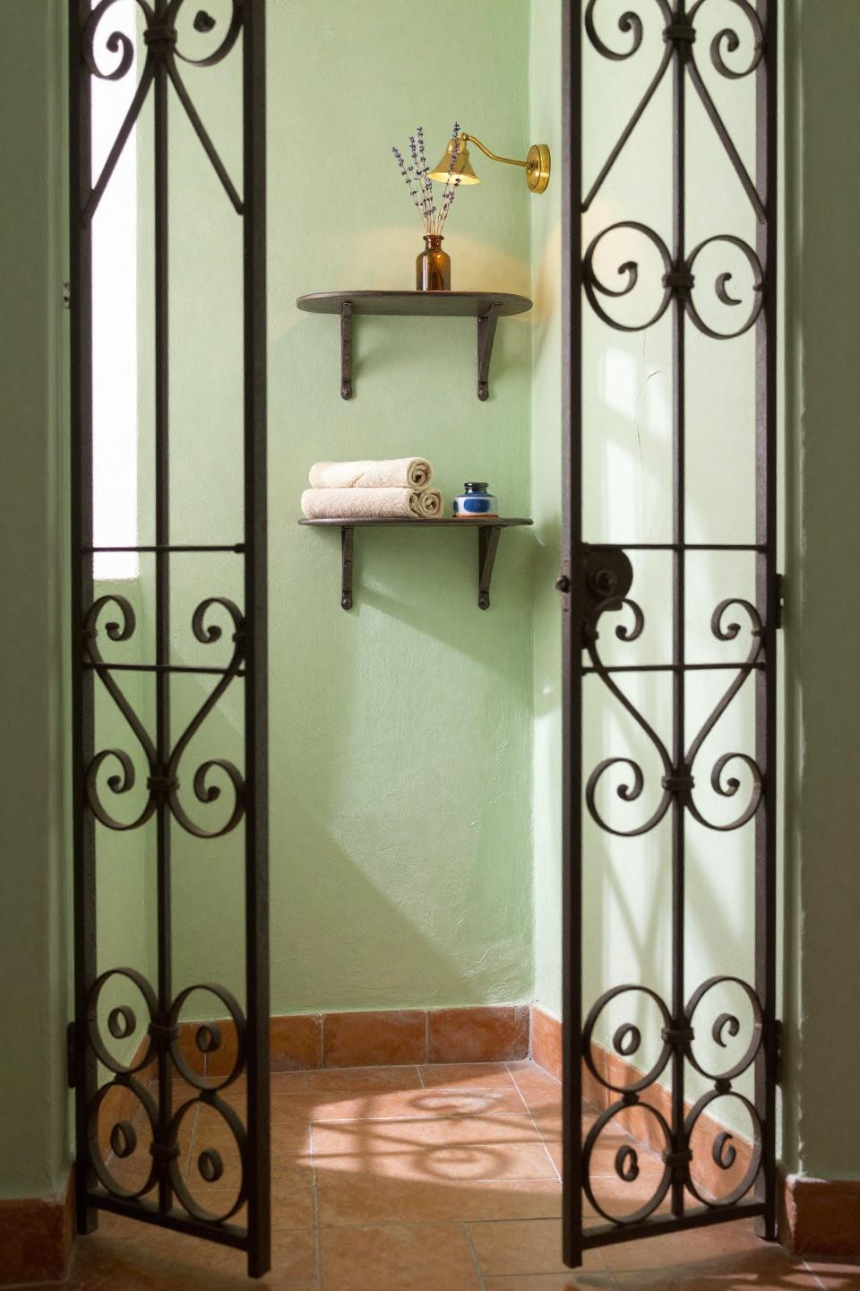 Narrow Toilet Room Ideas - celery green with brass sconce