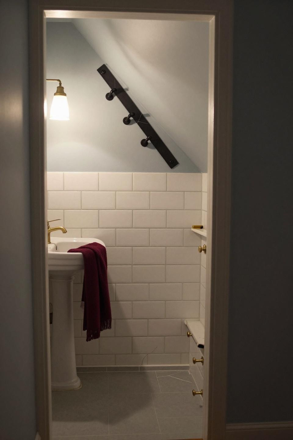Small Downstairs Toilet Ideas - under stairs with blackened steel rail