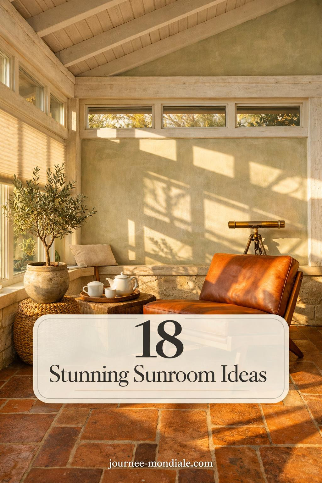 Compact south-facing sunroom featuring cognac leather mid-century chair, terracotta tile flooring, potted olive tree, sage limewash walls, and warm golden hour light