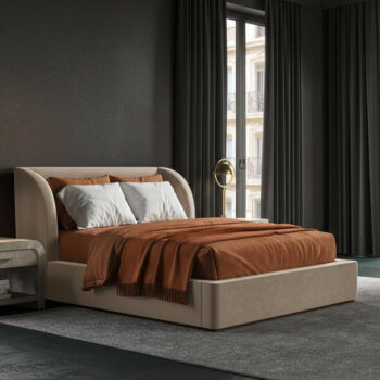Moody guest bedroom with charcoal plaster wall, dark oak floors, raw umber linen bedding, burnt orange mohair throw, and warm amber brass lamp