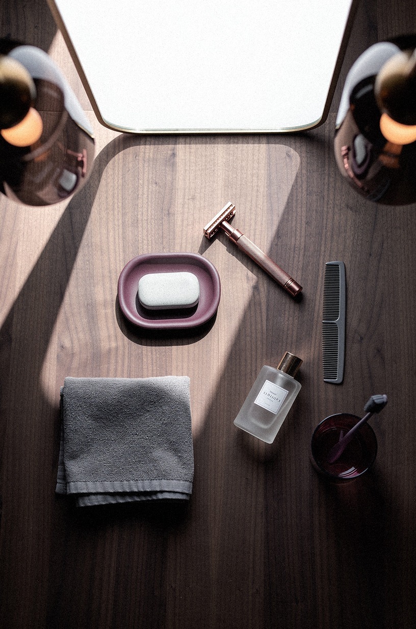 Mount smoked glass sconces beside the mirror