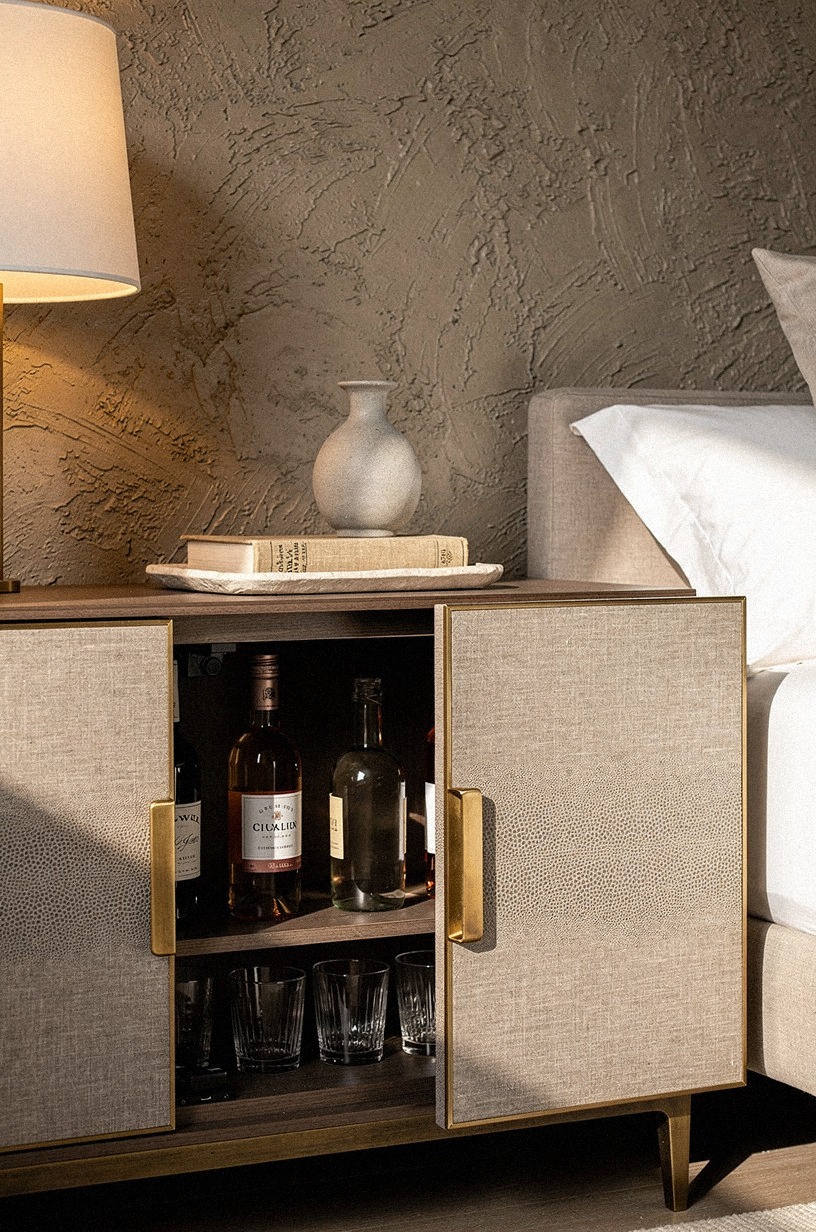 Slide nightstand panels over bottle storage