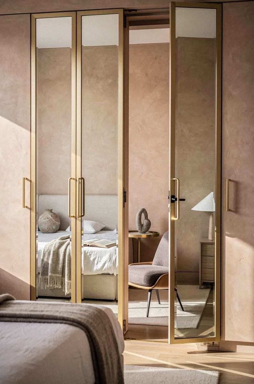 Disguise the entrance behind full-length mirror panels