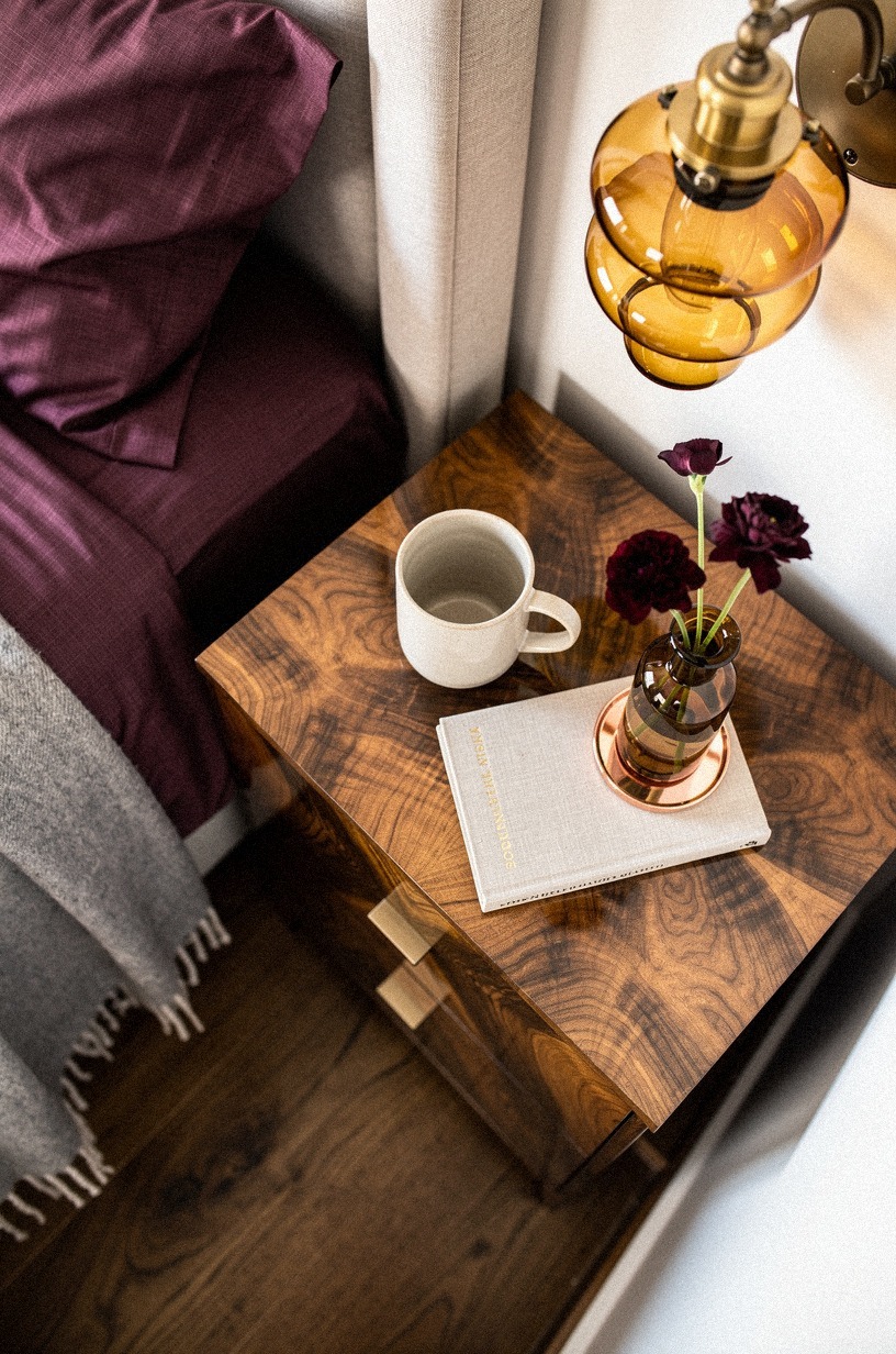 Layer amber sconces beside the nightstands
