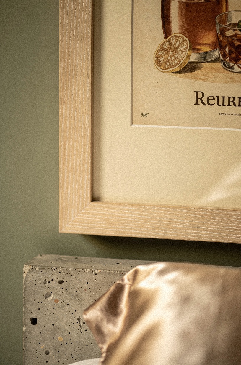 Frame vintage cocktail prints above the bed