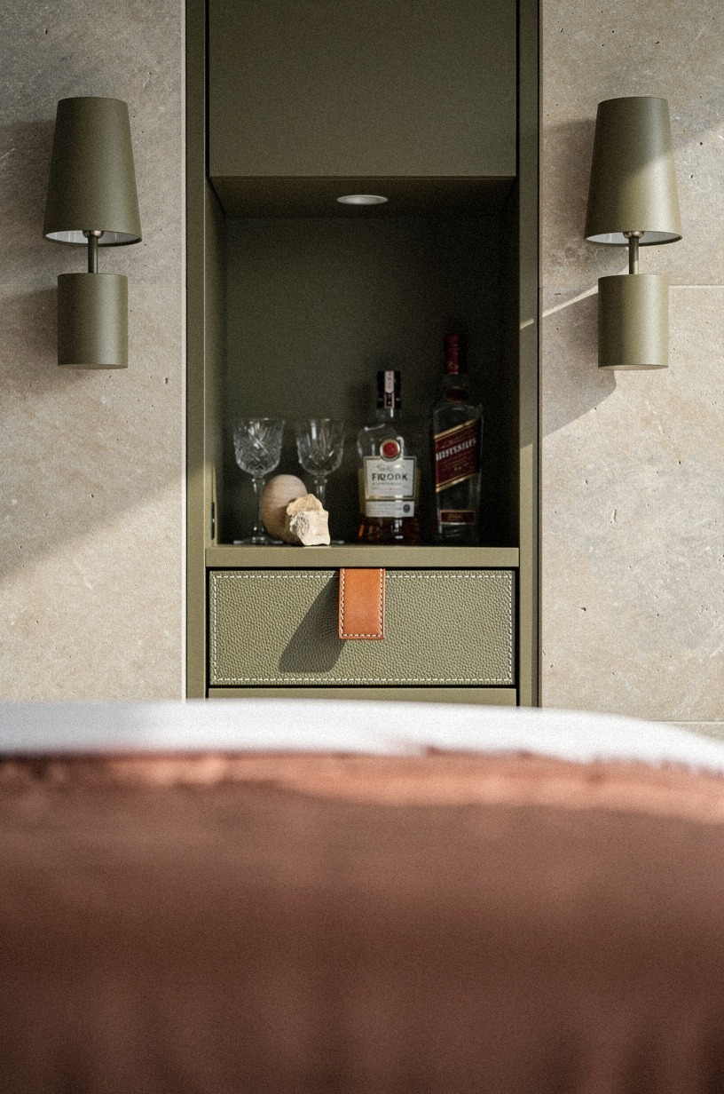 Frame a tucked-away bar with bedside sconces