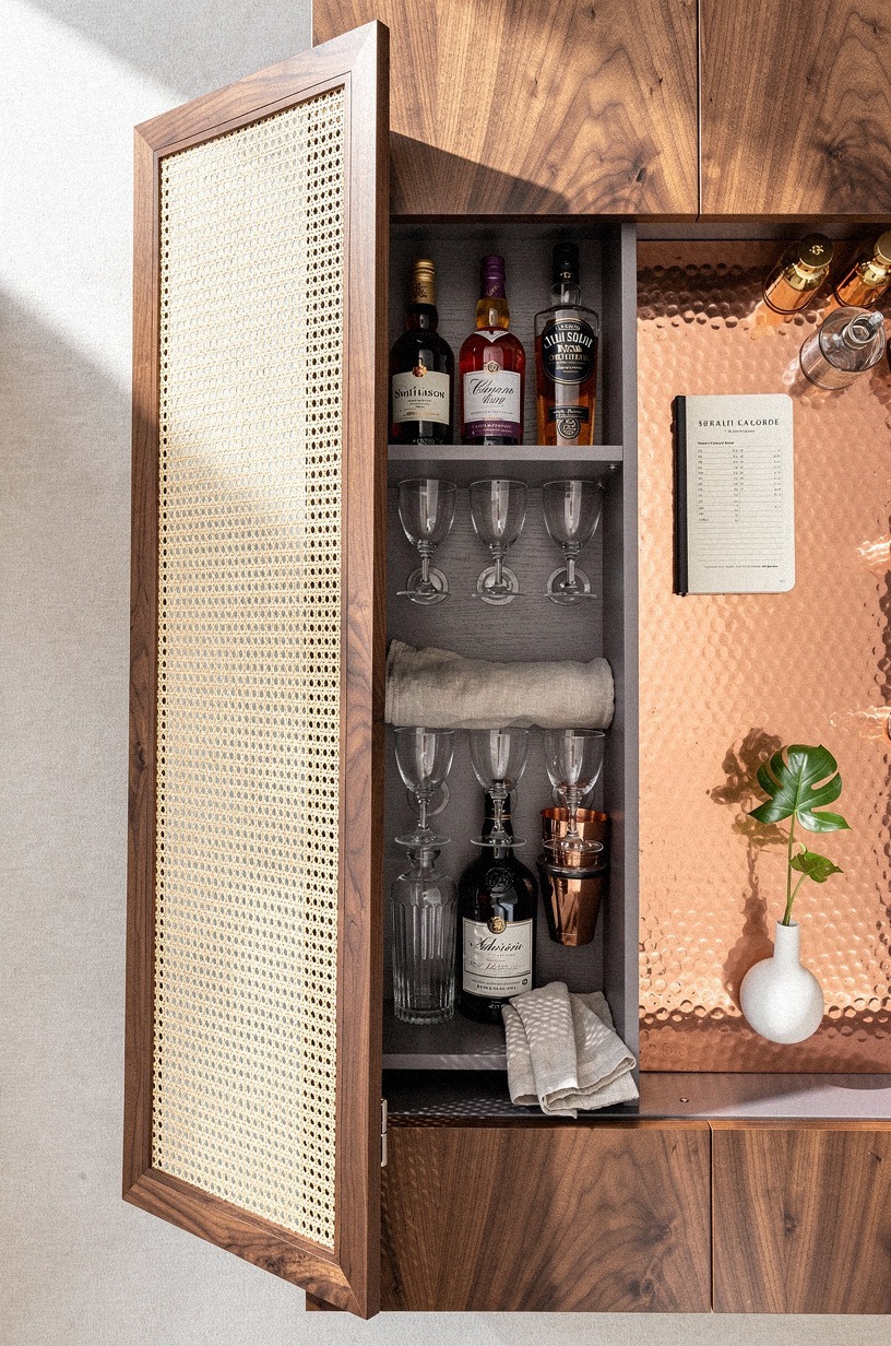 Hide bottles behind cane cabinet doors