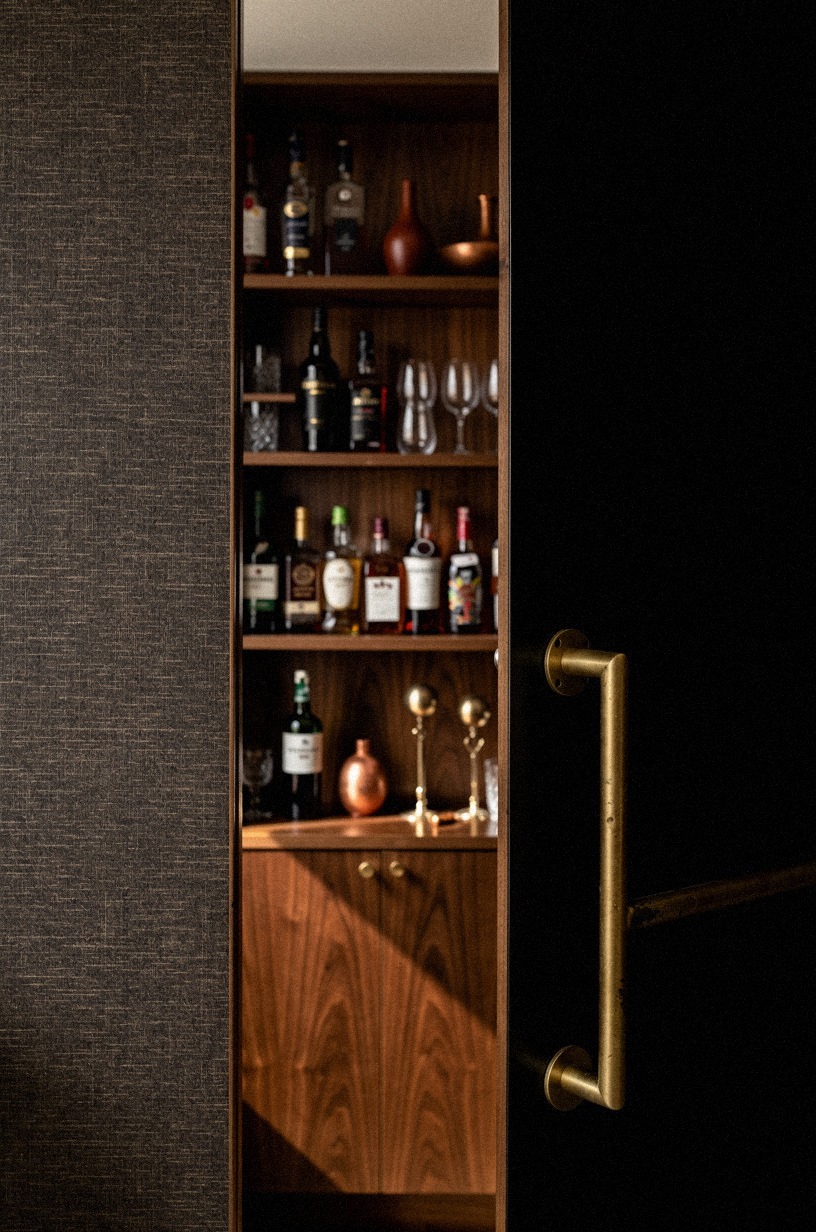 Wrap shelves in dark grasscloth