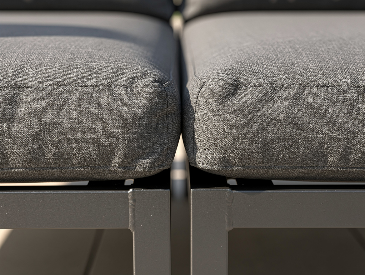 close-up detail of two armless modular outdoor sectional pieces pushed together