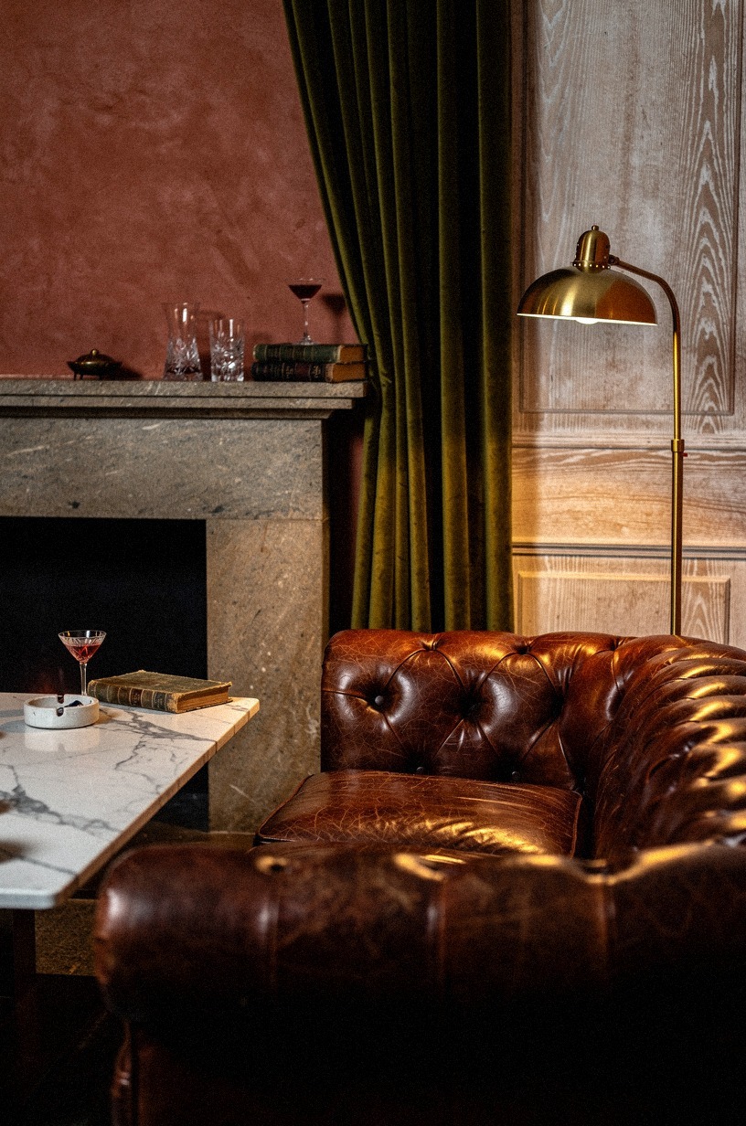 Start with a deep leather chesterfield as your anchor