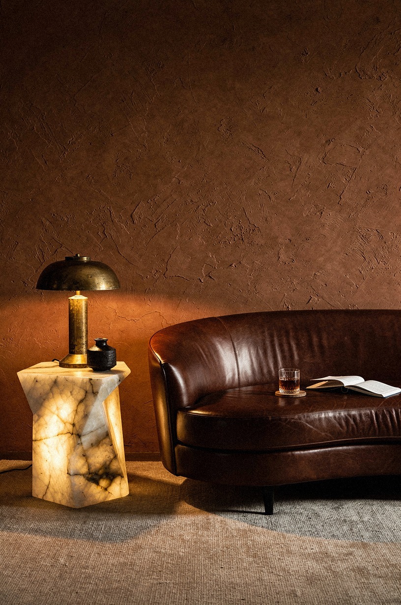 I chose a curved sofa in dark cognac leather