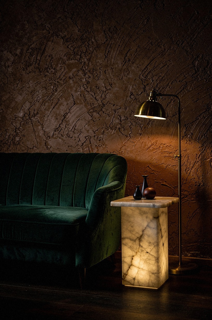 The backlit bar shelf: smoked glass meets brass rails