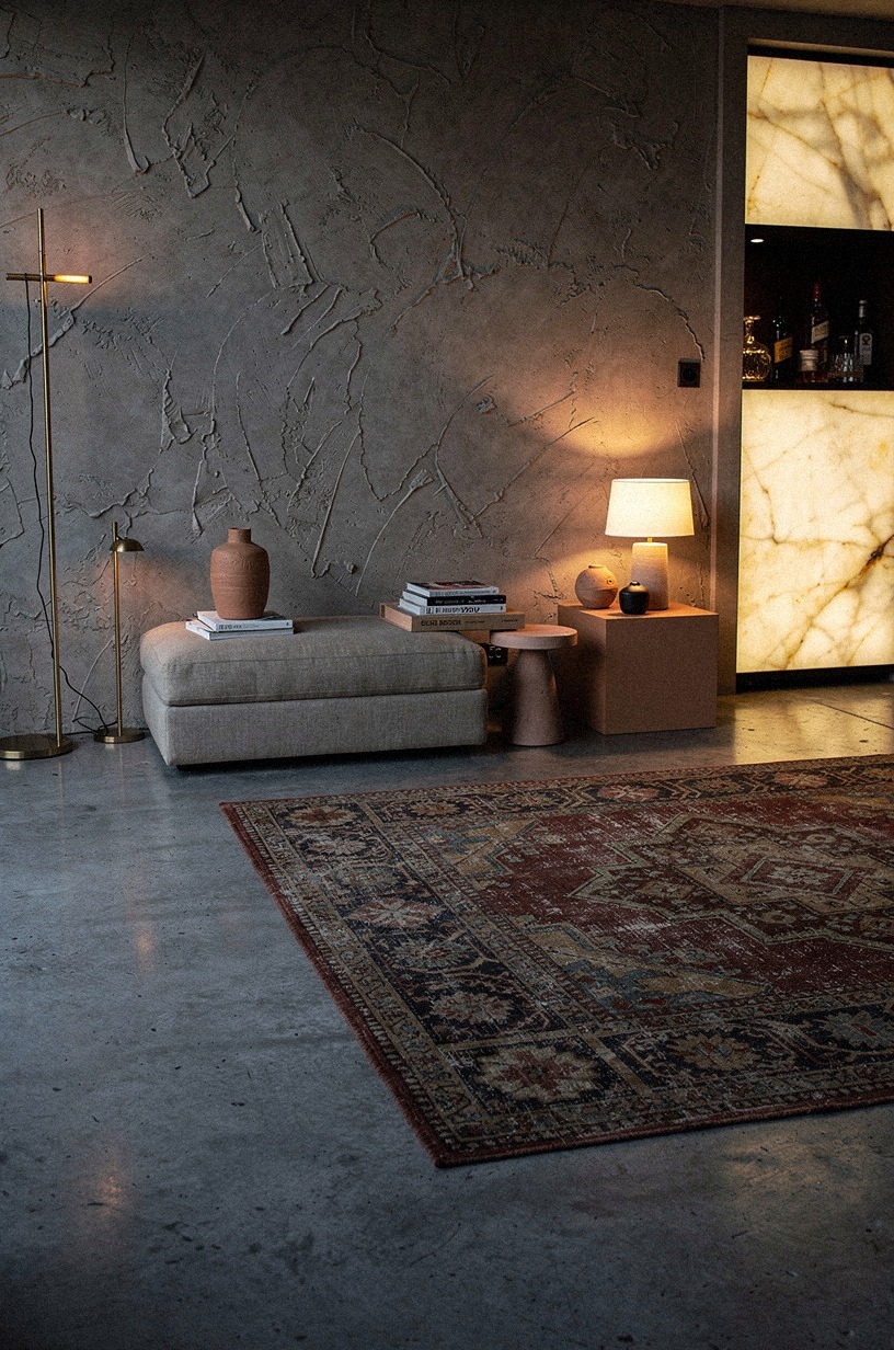 Layer a Vintage Persian Rug Over Raw Concrete to Kill the Echo