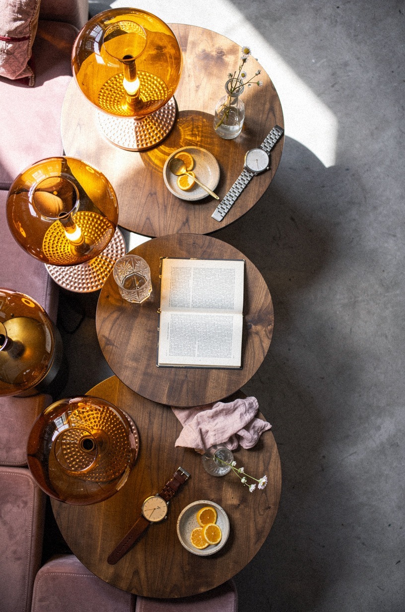 Cluster amber glass lamps on side tables