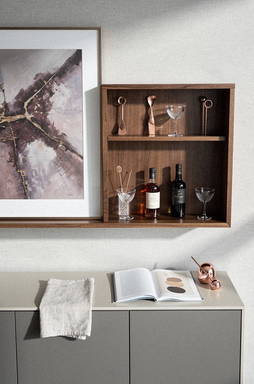 Why does a shallow art-front cabinet beat a freestanding bar?