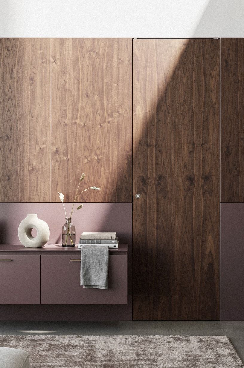 Camouflage the door with matching millwork