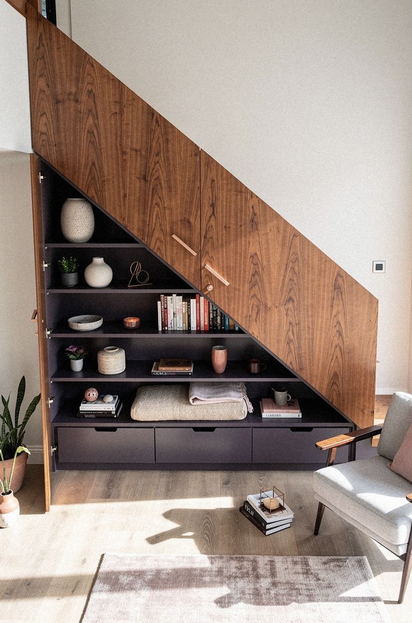 A tall bookcase gave the stair opening a believable face