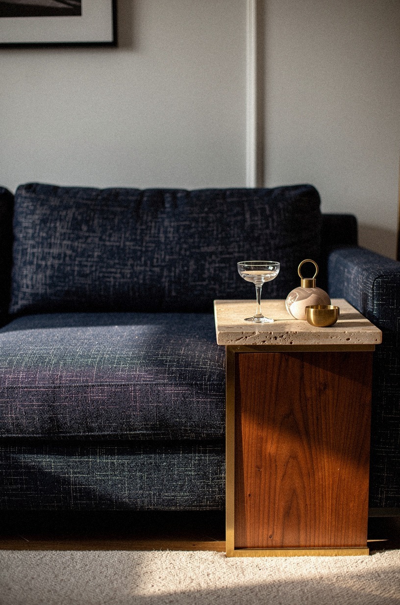 Tuck a brass tray table beside the sofa