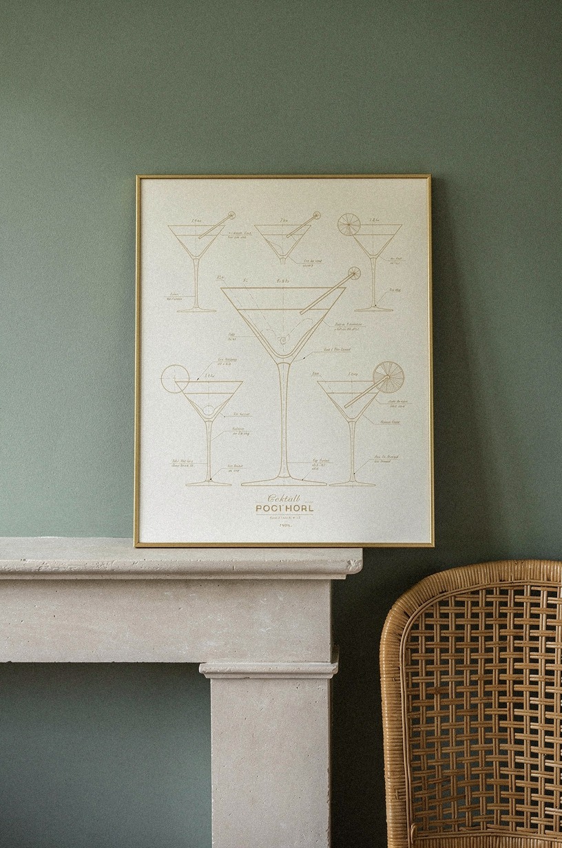 Lean oversized cocktail blueprints on the mantel