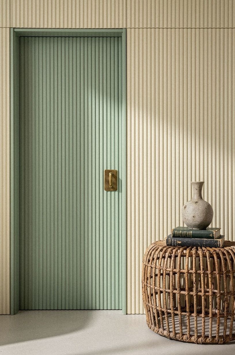 Camouflage the door with fluted wood slats