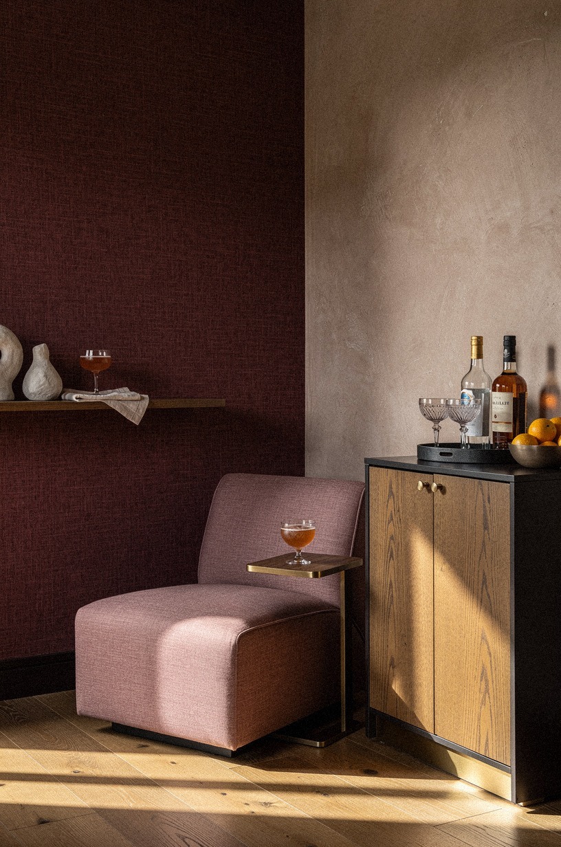 Wrap the corner in oxblood grasscloth
