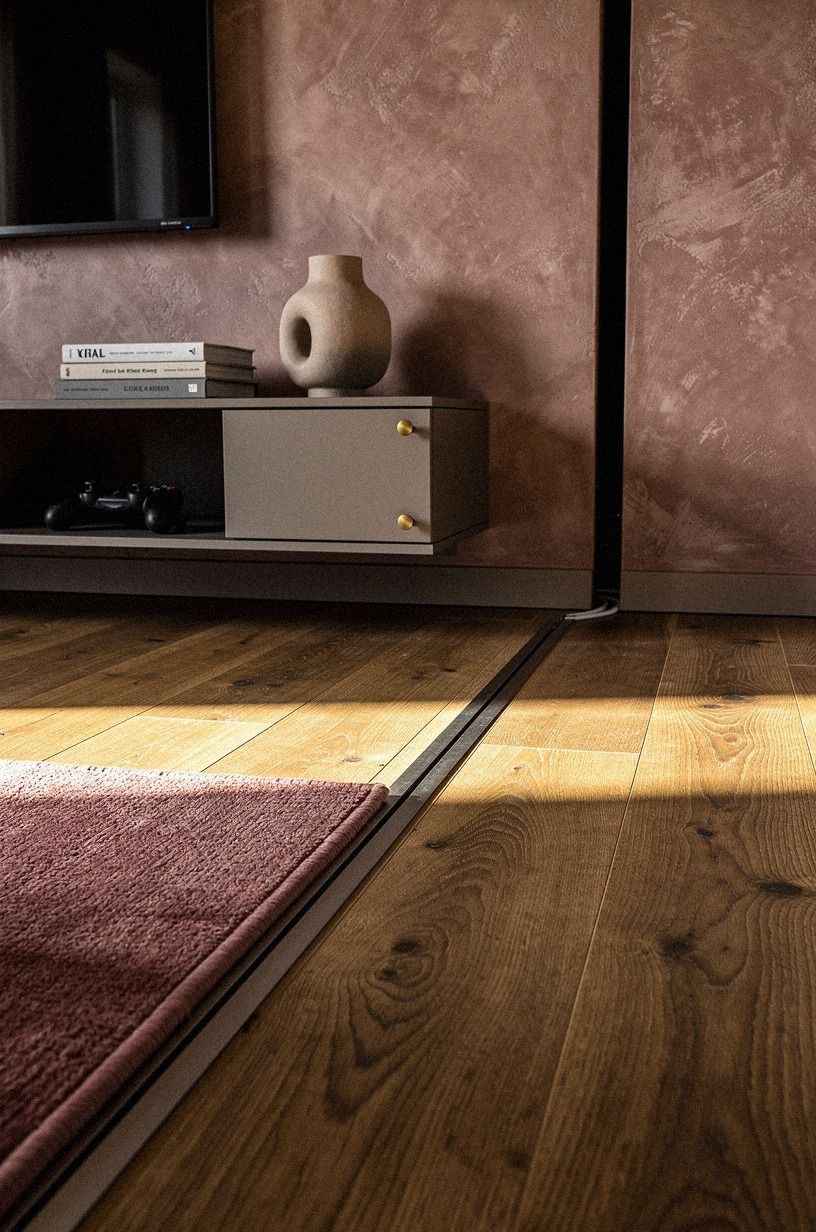 Run cable channels under the area rug