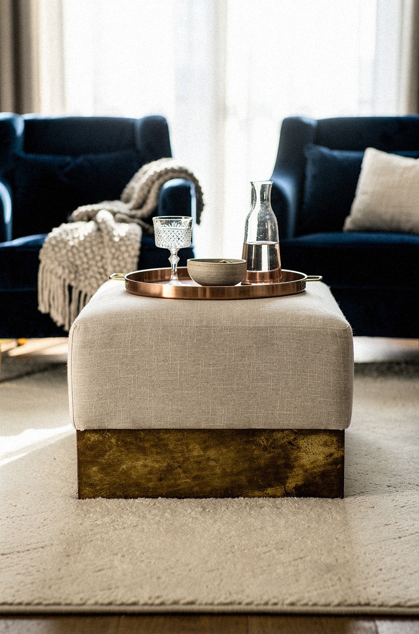 I layered a small ottoman between the chairs