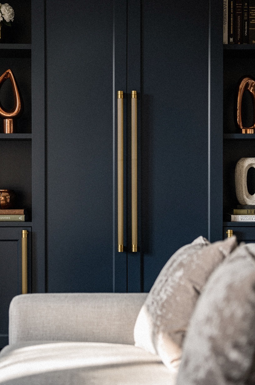 Install ribbed brass pulls on built-ins