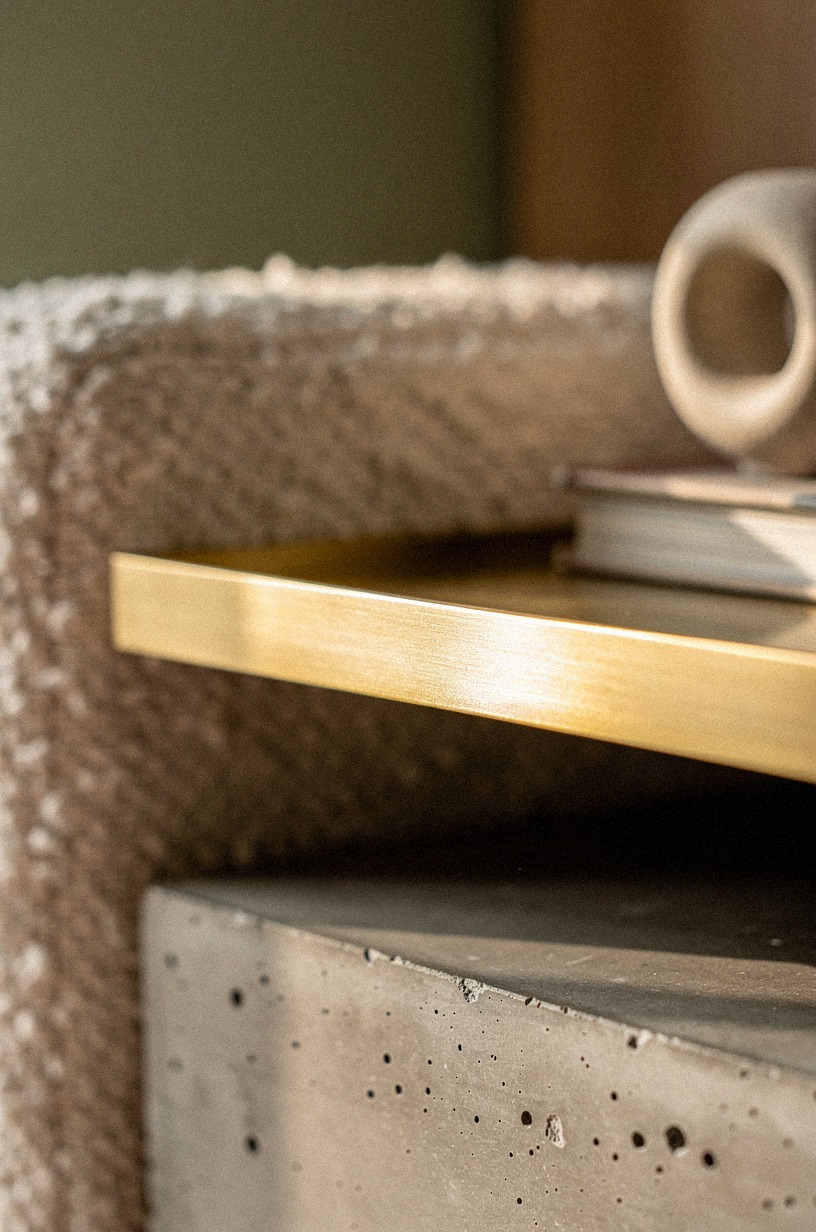 Float a gold shelf above the console
