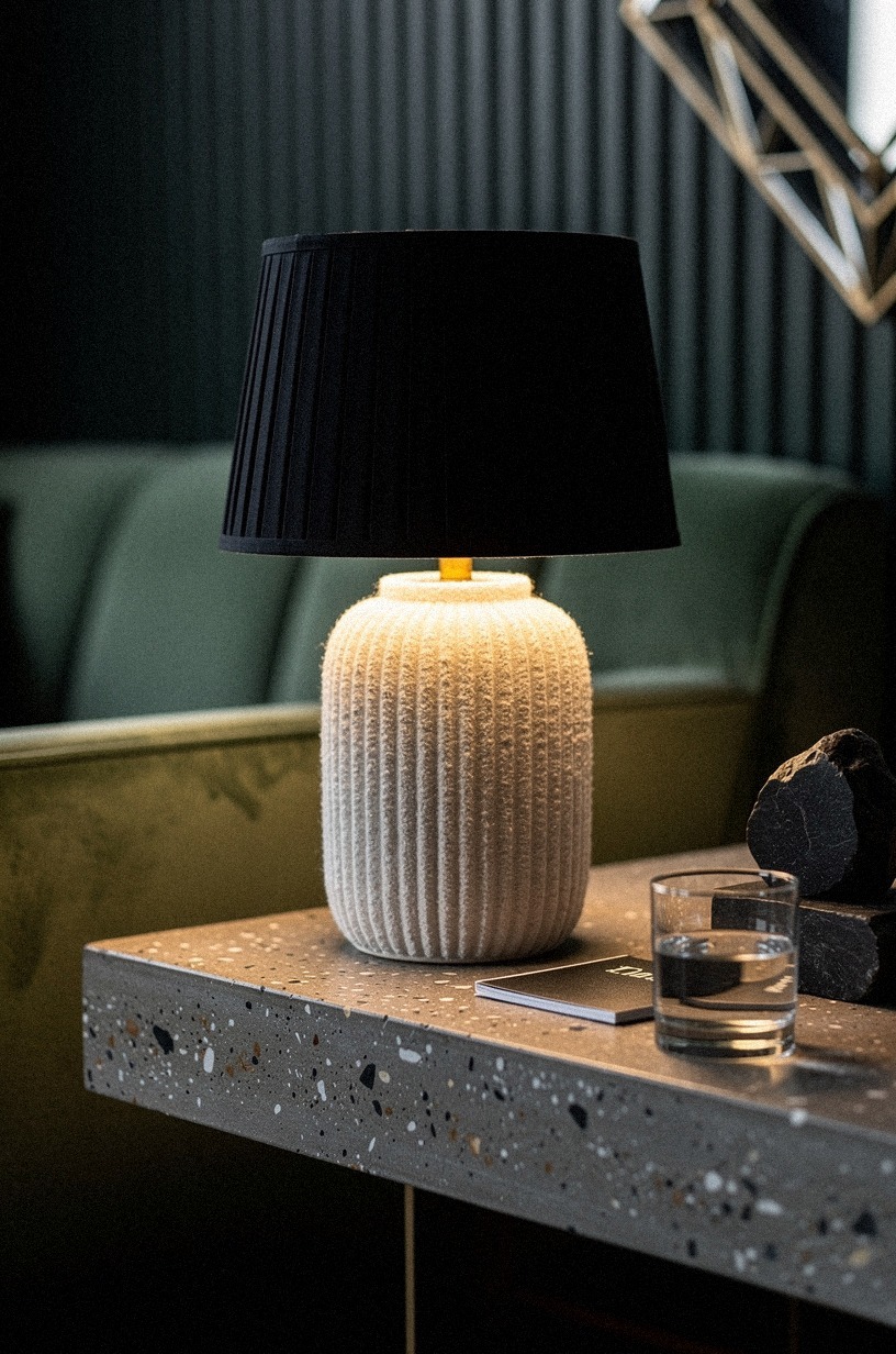 Set a pair of fluted table lamps with black shades on either side of the sofa