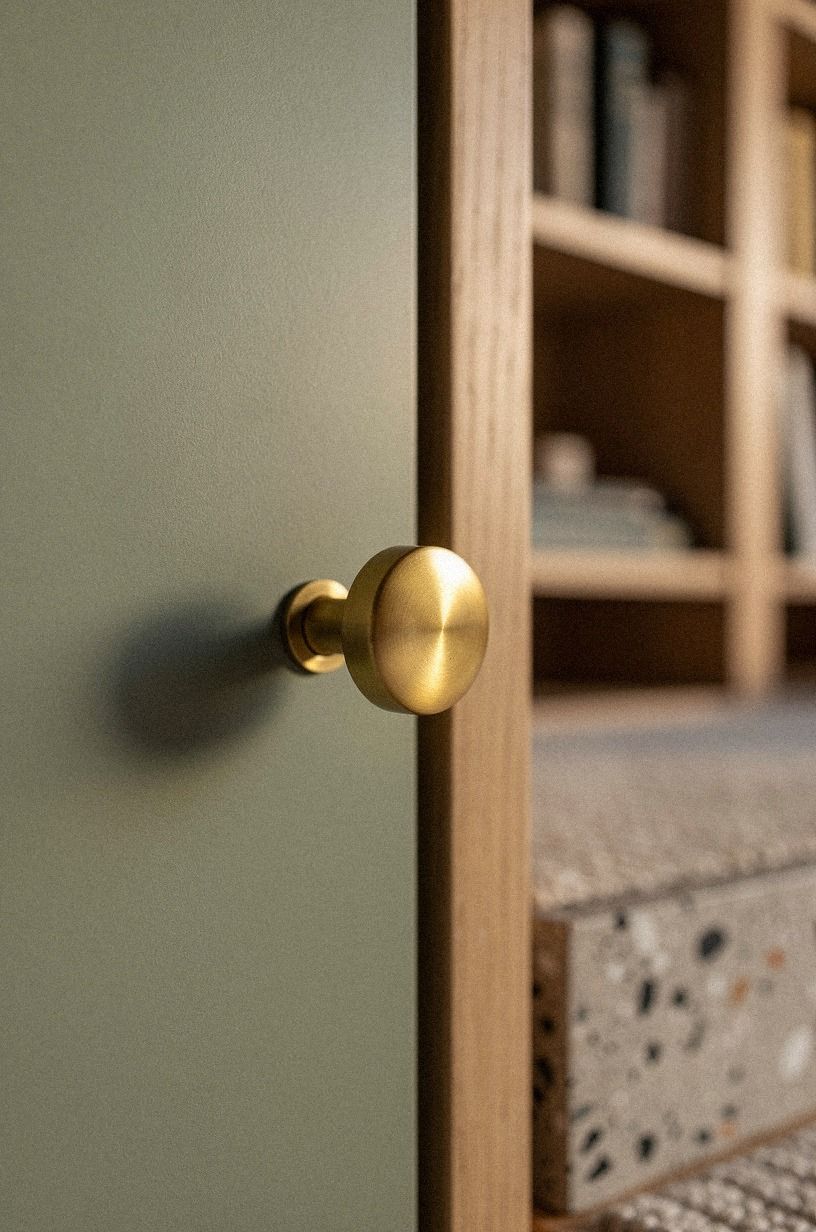 I hid the release behind an unlacquered brass knob