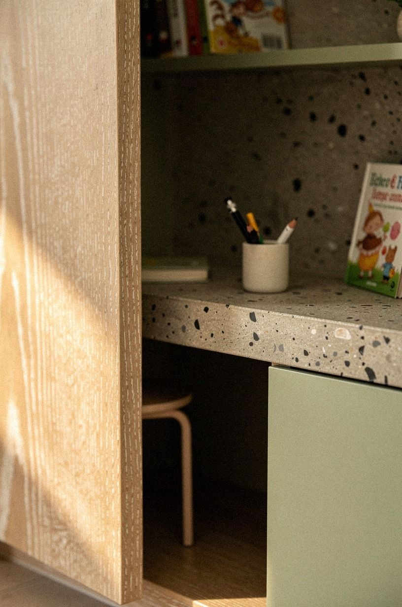 Why a tiny desk behind bookcase doors beats a homework nook