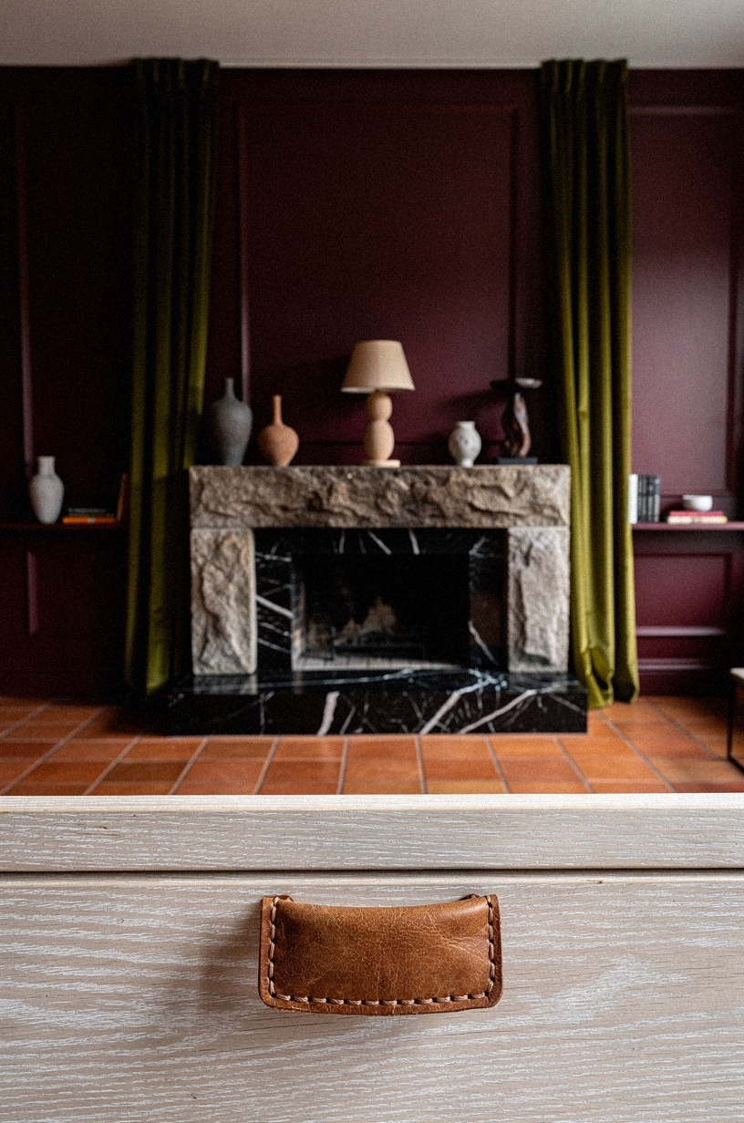 Propagate amber glass decanters on a substantial mantel