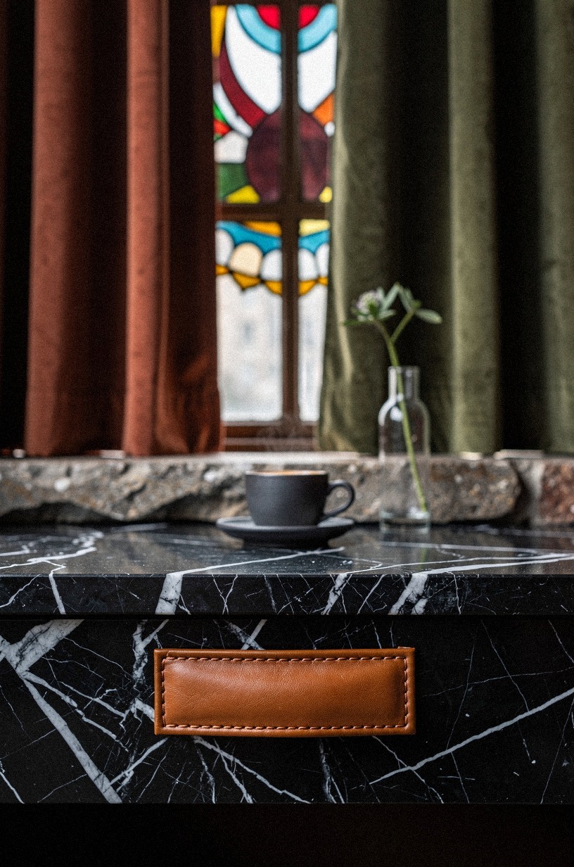 Lower the curtain line with cafe panels below stained glass