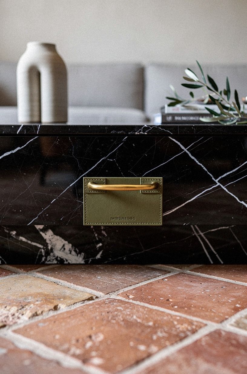 Add a brass handle disguised as decor