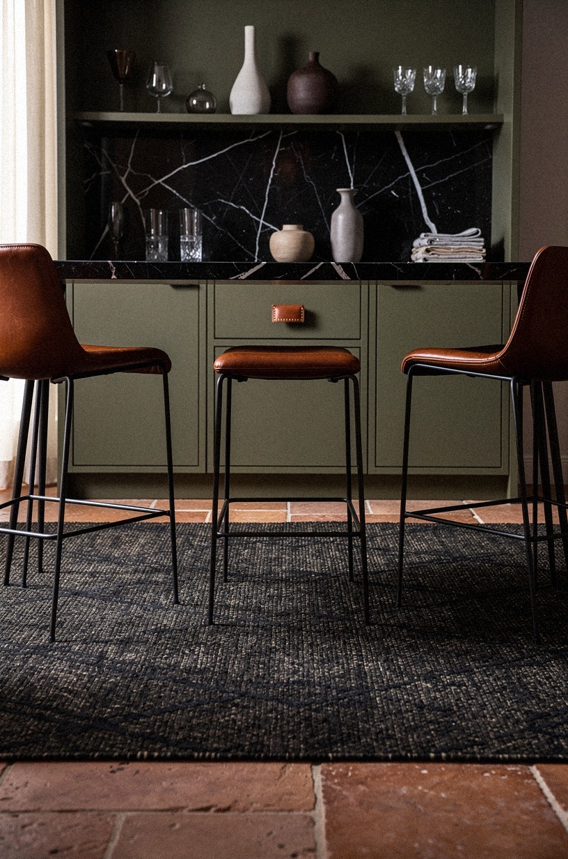 Layer a dark rug under the stools