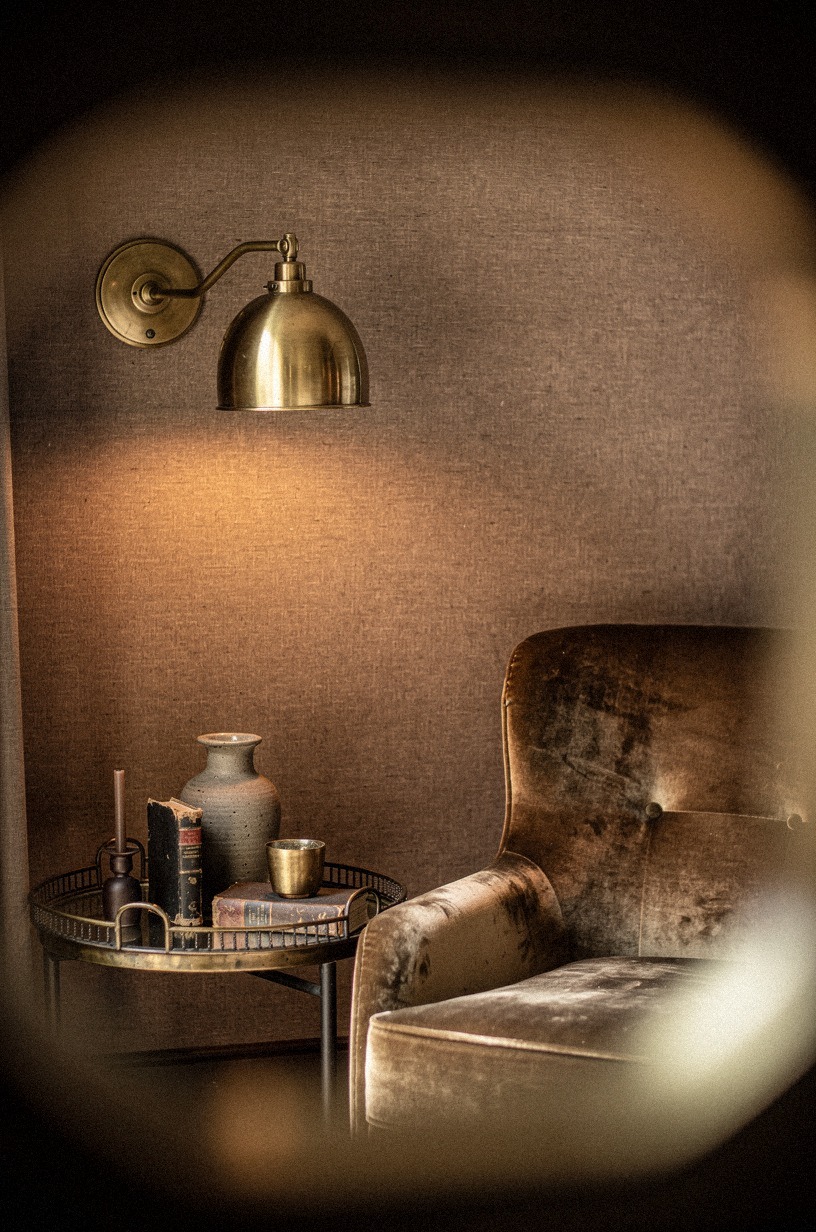 Mirror sconce light through antique brass trays