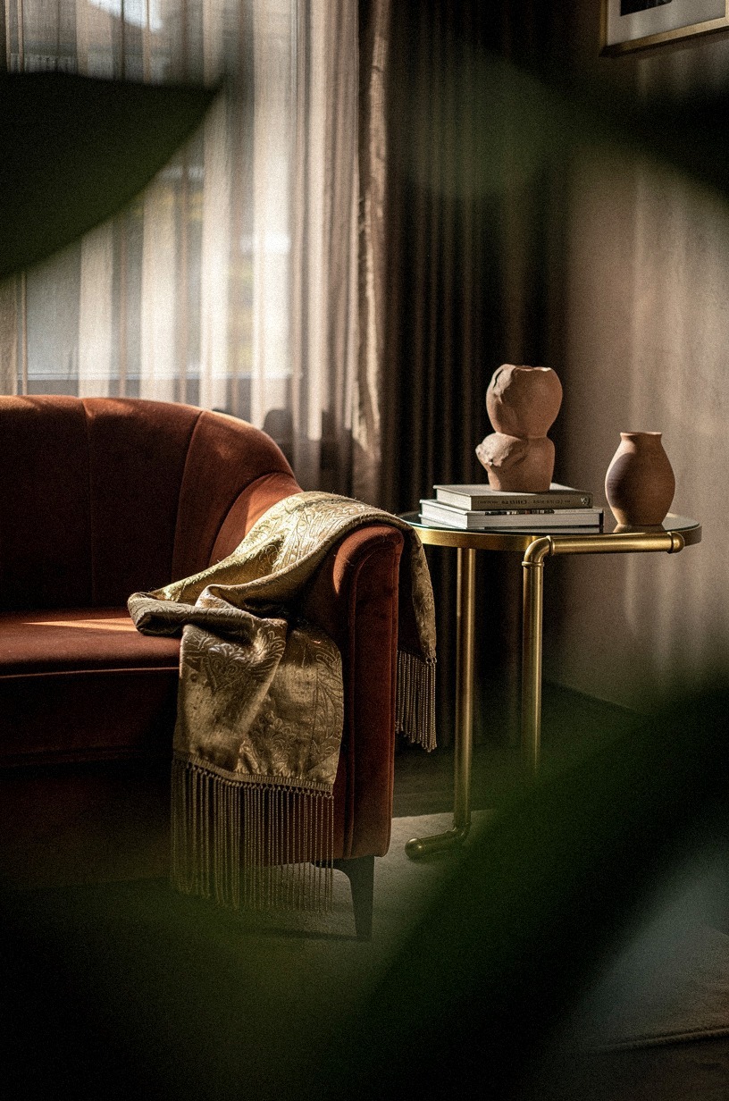 Drape a fringed silk or velvet throw over the arm of a club chair for tactile contrast