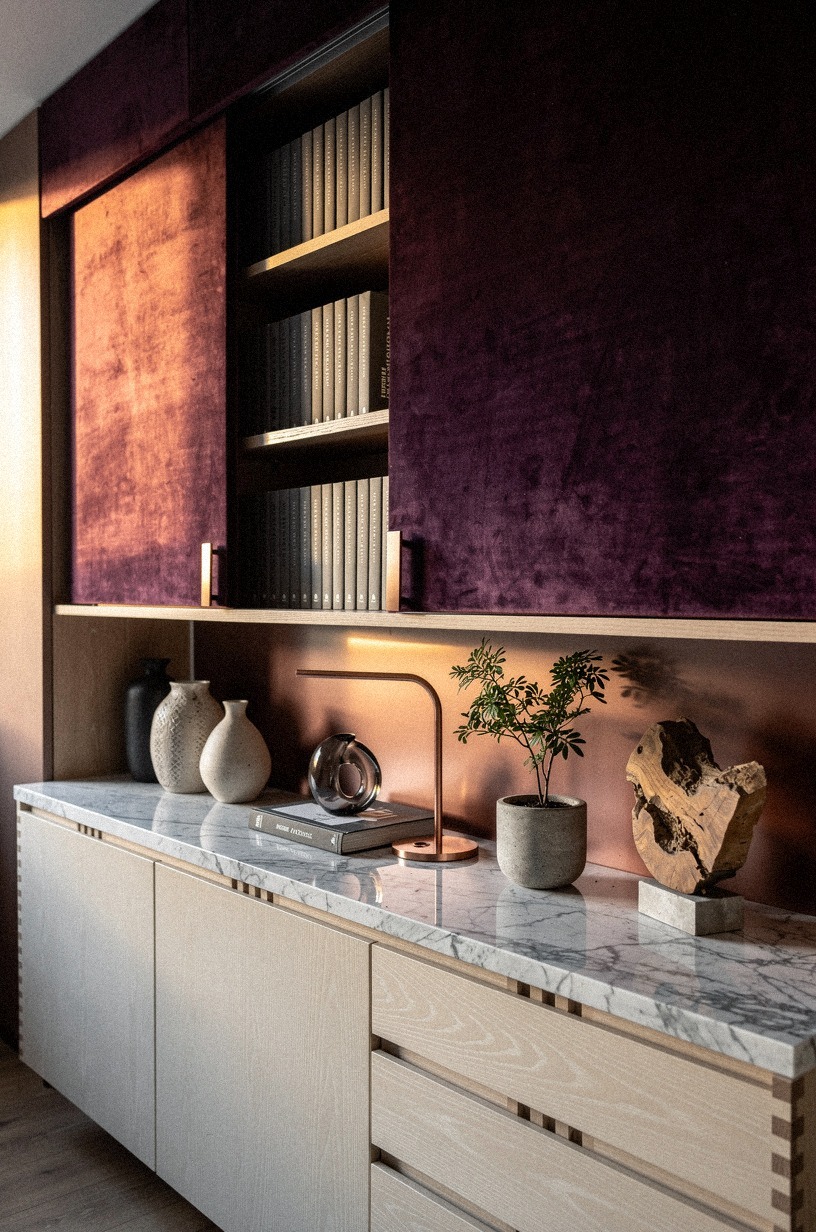 Slide plum velvet panels across open shelving