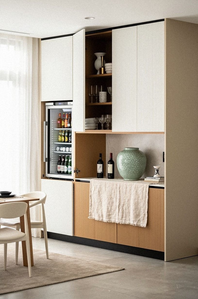 Conceal a mini fridge behind fluted base cabinets