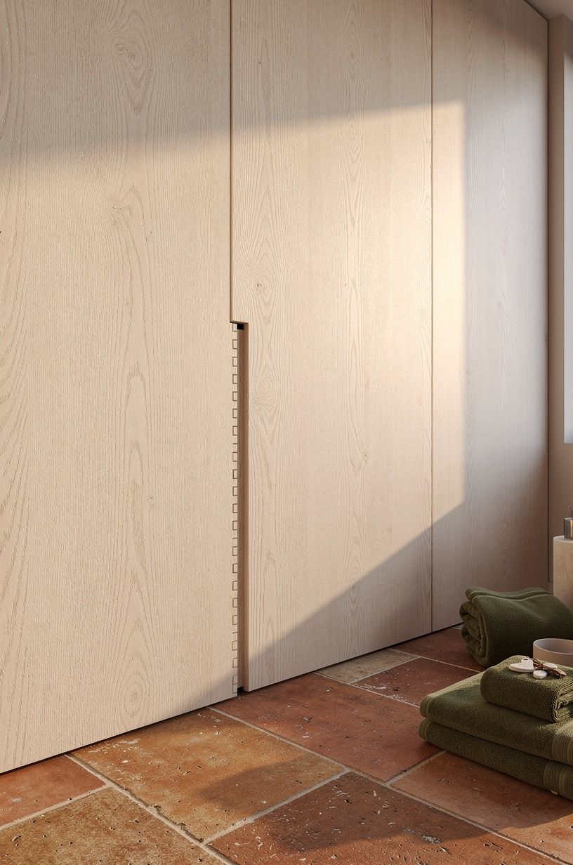 Hide the linen cabinet inside wall paneling