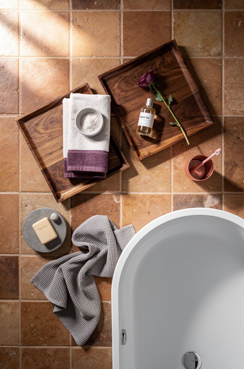 Layer terra-cotta tiles around the tub