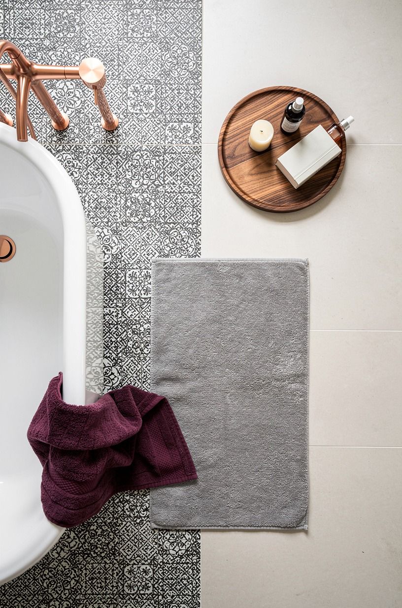 Wrap the tub apron in graphic mosaic tile